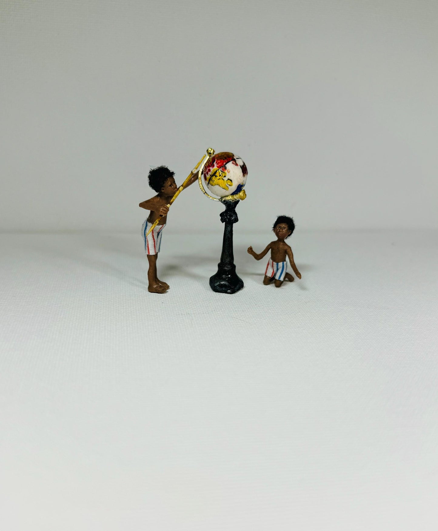 Miniature polymer clay ooak boy toy dolly 1:48 scale dollhouse micro dolly art doll handmade by Lana Hallas.