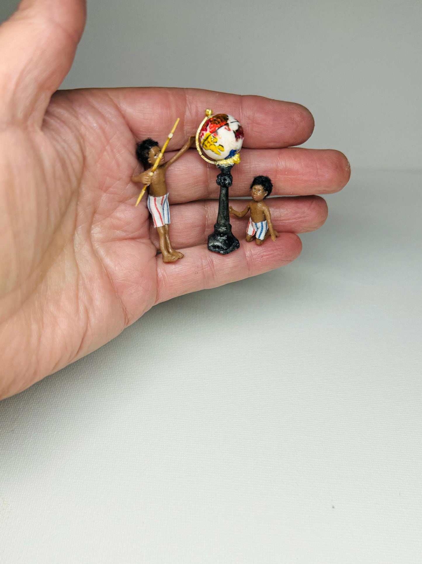 Miniature polymer clay ooak boy toy dolly 1:48 scale dollhouse micro dolly art doll handmade by Lana Hallas.